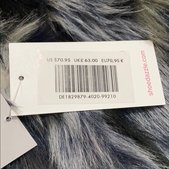 We are selling a multicolor vest that is brand new - Picture 4 of 4